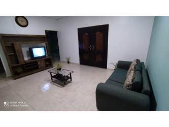 Simple kitchen dining area with refrigerator gas stove house for rent Penonomé