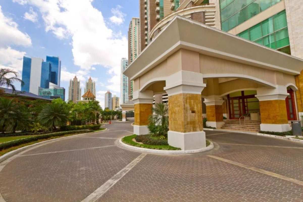 Architectural portico grand entrance of PH Pacific Point with landscaped drive and luxury towers