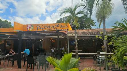 Tropical style outdoor dining at Picasso restaurant near Coronado beachfront Panama