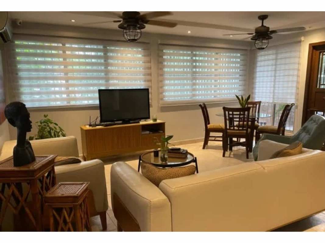 Minimalist indoor staircase with white railings and light tiles Condado del Rey Panama