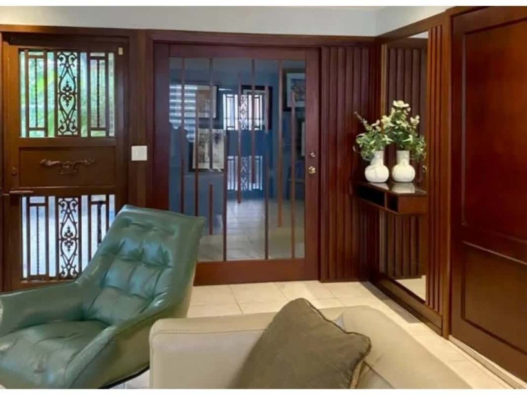 Spacious living and dining room with ceramic tile floors in Condado del Rey