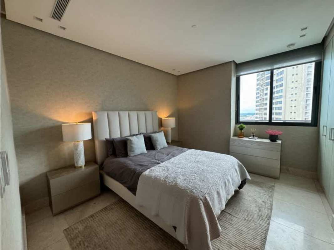 Modern master bedroom with ocean view floor-to-ceiling window PH Delux Tower Panama