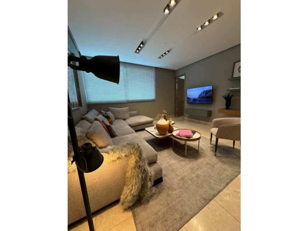 Modern living room with large sectional sofa, TV, luxury decor at PH Delux Tower Panama