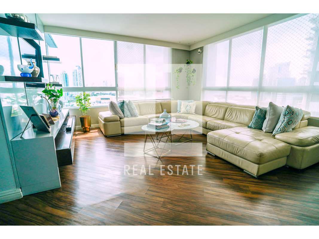 Elegant living room with floor-to-ceiling windows and skyline views, Panama City PH Bahia Obarrio