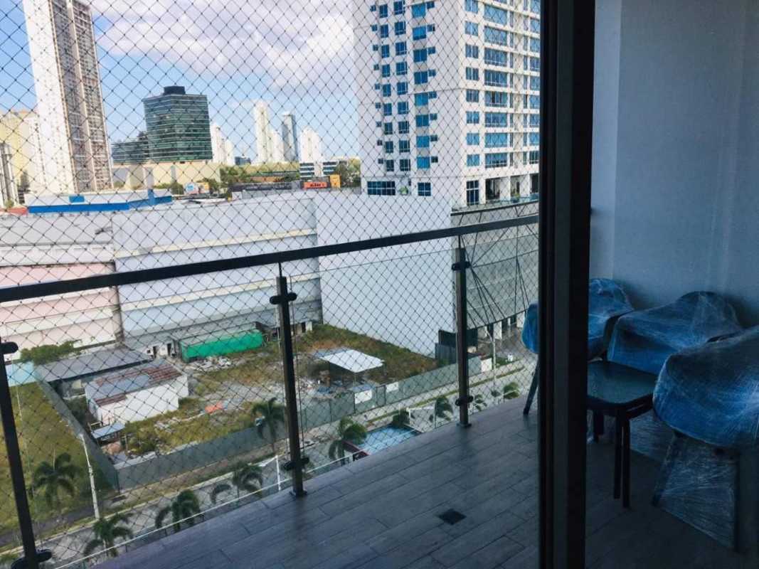 Balcony with glass railing offering panoramic Pacific ocean and city skyline views PH Bali Panama