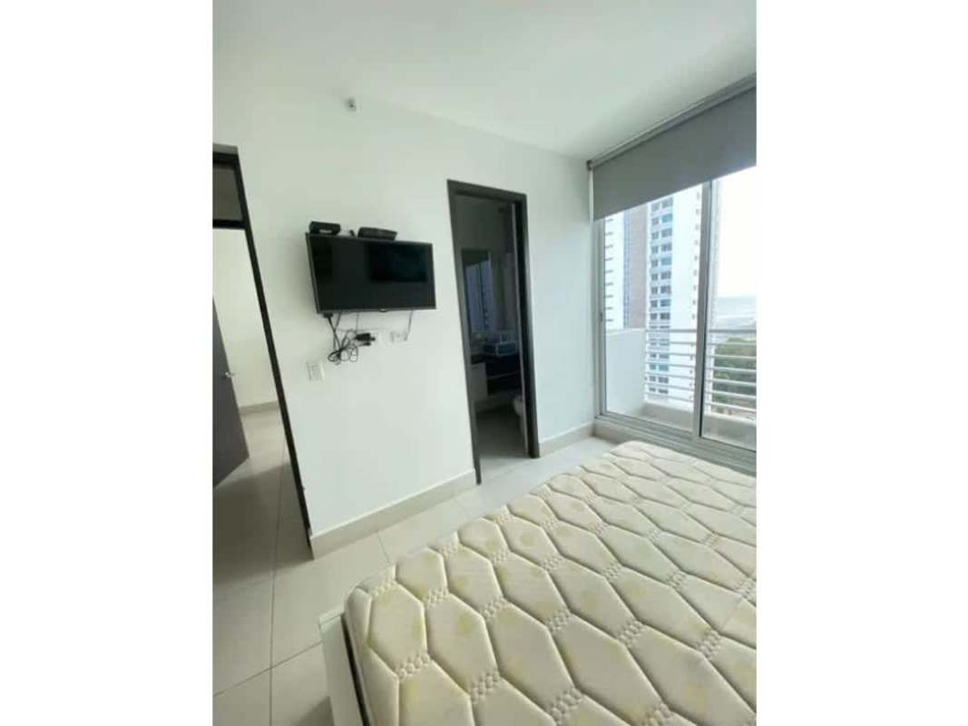 Open kitchen with breakfast bar and elegant cabinetry in Costa del Este condo