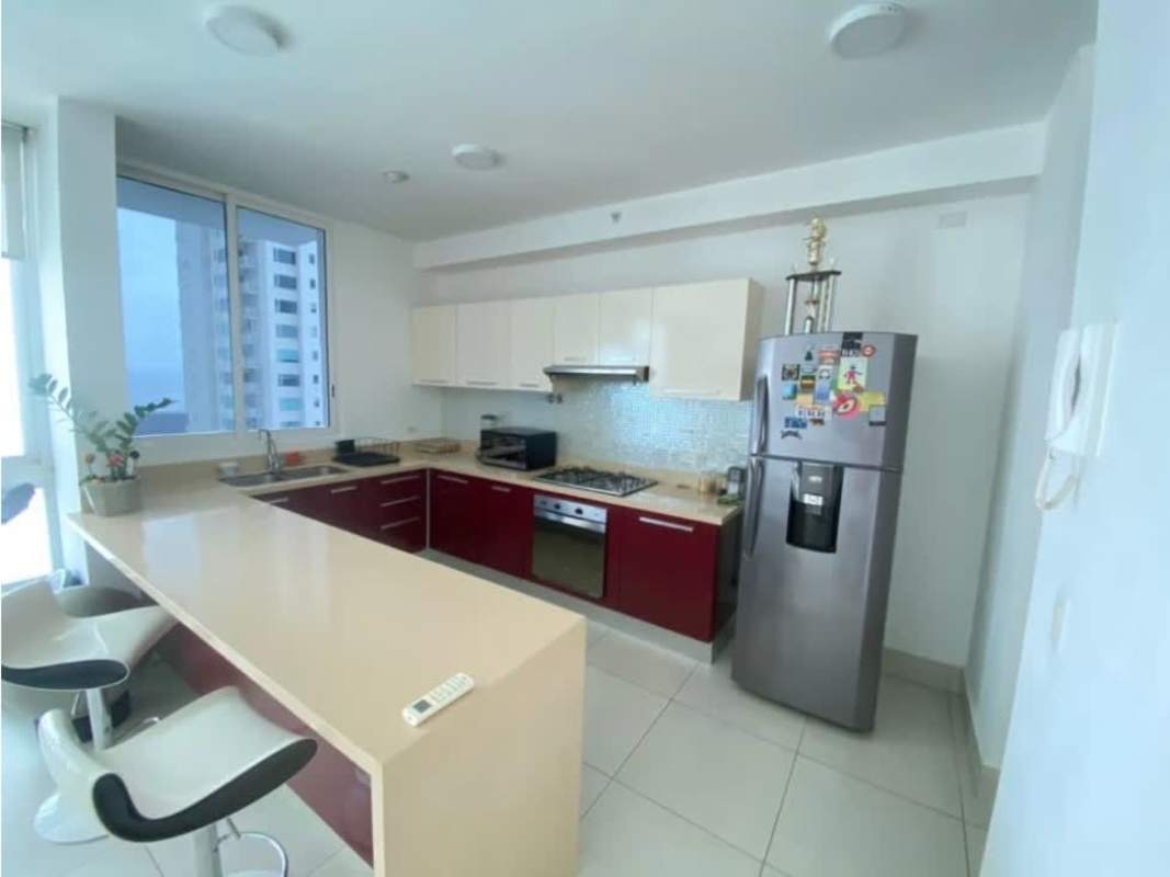 Living area with large windows and skyline views in Costa del Este apartment Panama