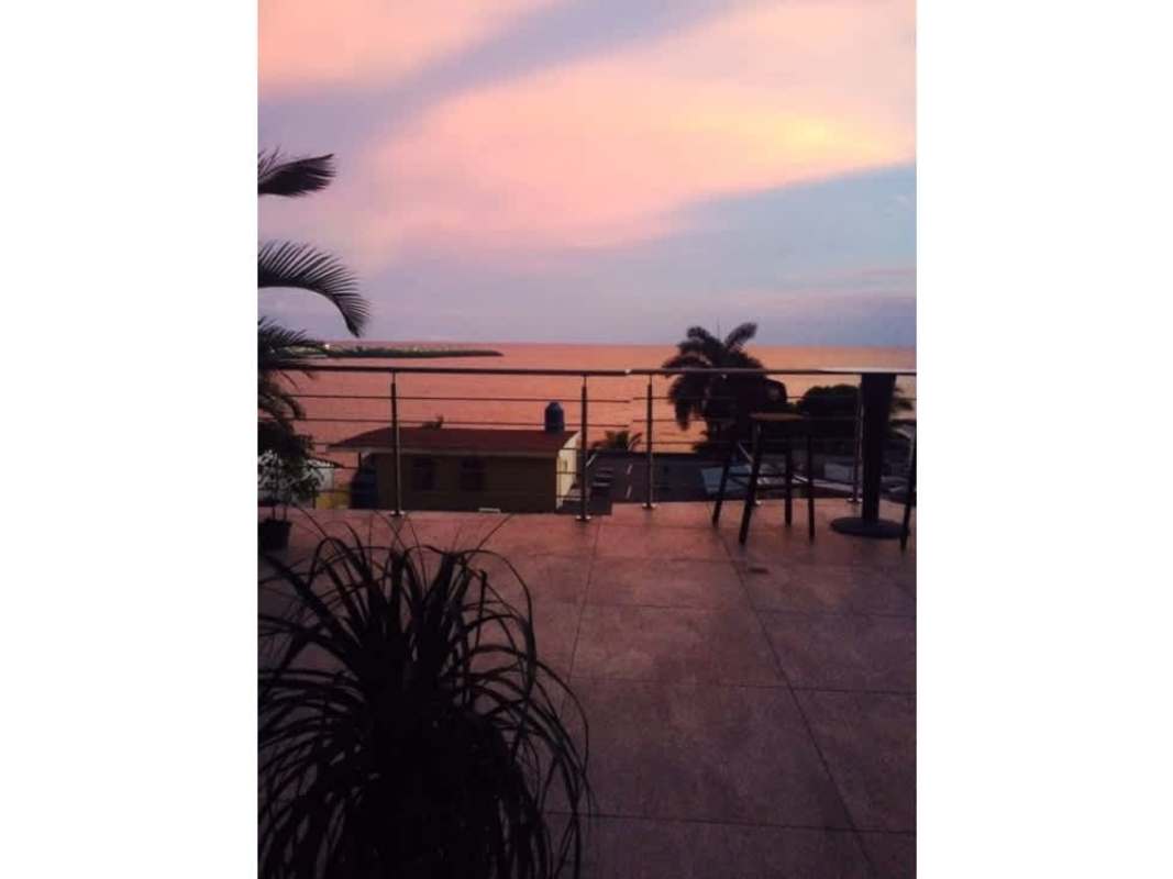 Open concept bright living room with water views in PH Camino Real Paitilla