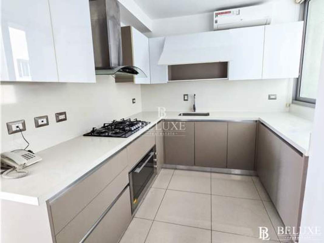 Bright bedroom with large window and view of Pacific Ocean at PH Bali Panama