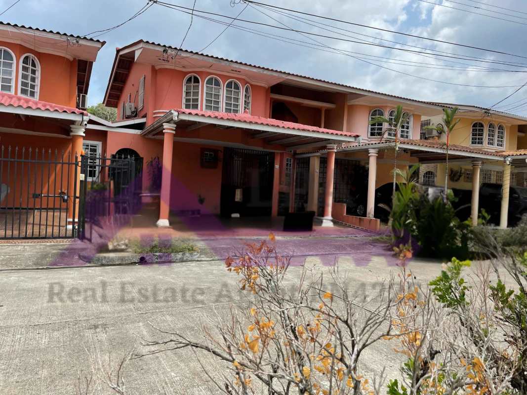 Entryway staircase with large window and neutral walls duplex house Panama