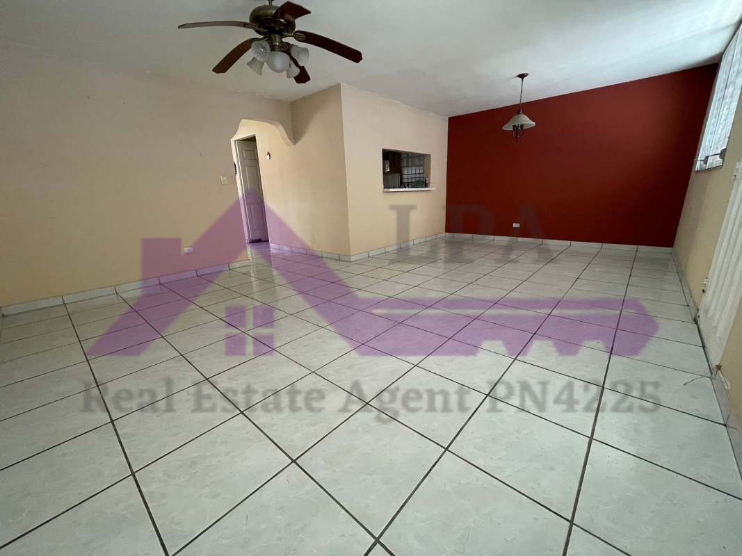 Modern semi-open kitchen with wood cabinetry and quality finishes in duplex house Panama