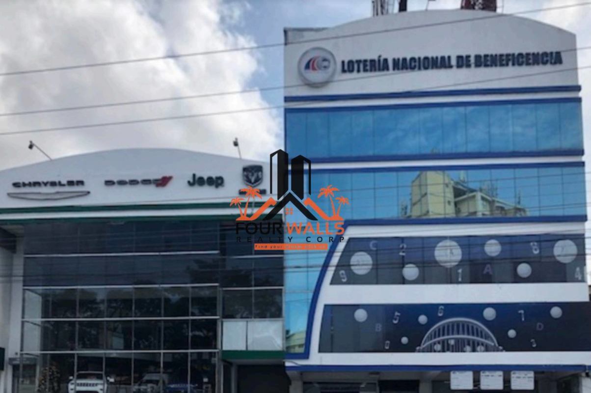 Facade of Plaza Los Angeles commercial building with signage and glass windows in Panama City