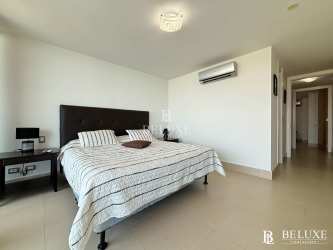 Infinity swimming pool surrounded by palm trees with ocean view at PH Bahia Nueva Gorgona Panama