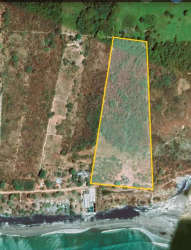 Aerial shot showing outlined beachfront property with Pacific shoreline in Juan Hombrón Panama