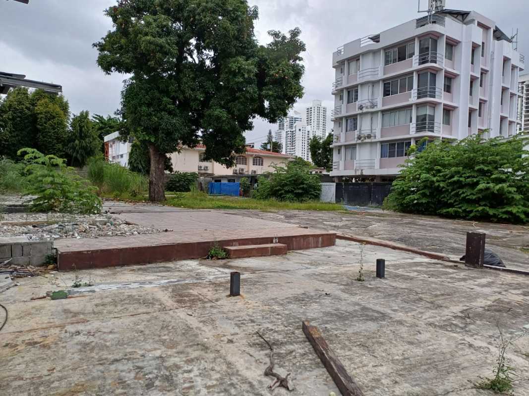 Vacant land with concrete ground and tree near high-rise buildings Vía Israel Panama City