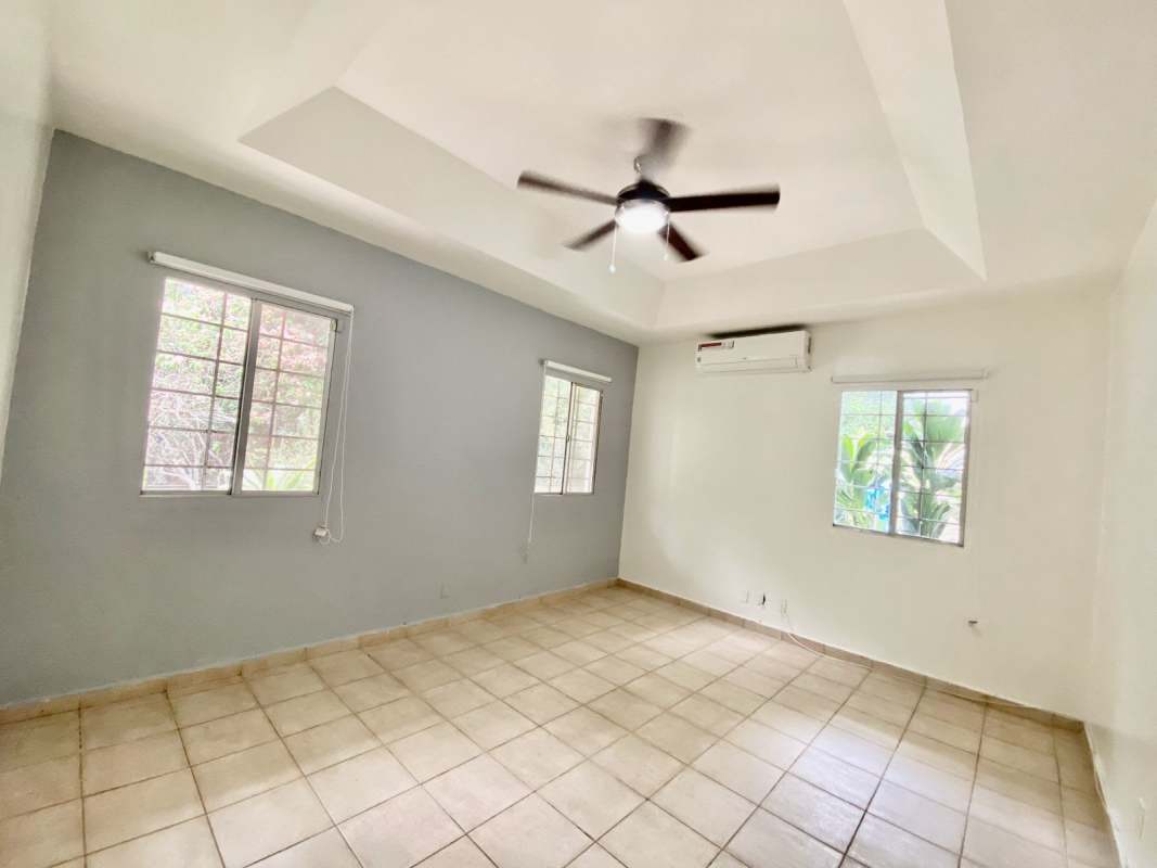 Bedroom with tile floor, bay window, ceiling fan, in quiet neighborhood Albrook Panama