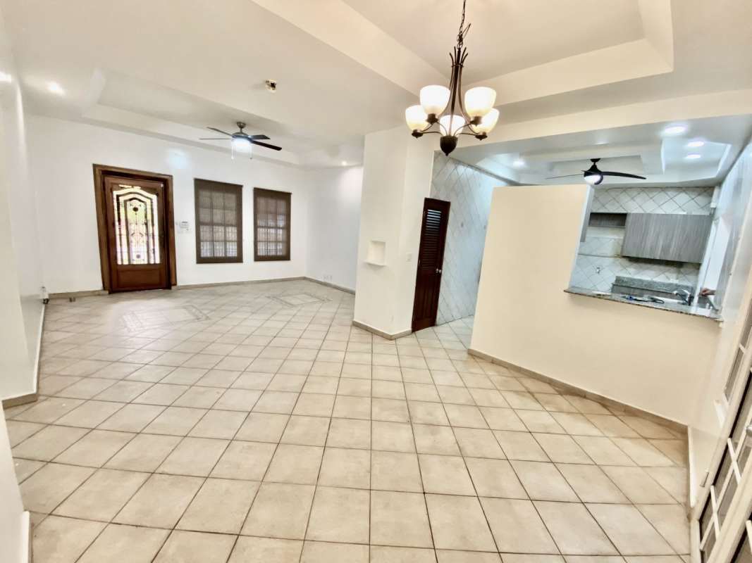 Modern bathroom with glass shower, tile floor, frosted window in Albrook house for sale Panama