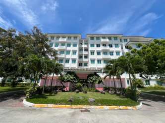 Multi-story beachfront condominium with tropical gardens, balconies at Bijao Beach Club Panama