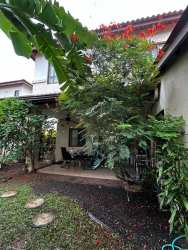 Two-story duplex with Mediterranean clay tile roofing and double carport Panama Pacifico