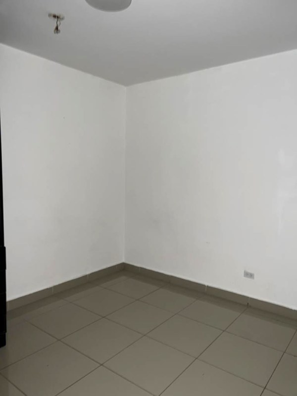 Primary bedroom with window tiled floor PH Centennial Parque Lefevre Panama