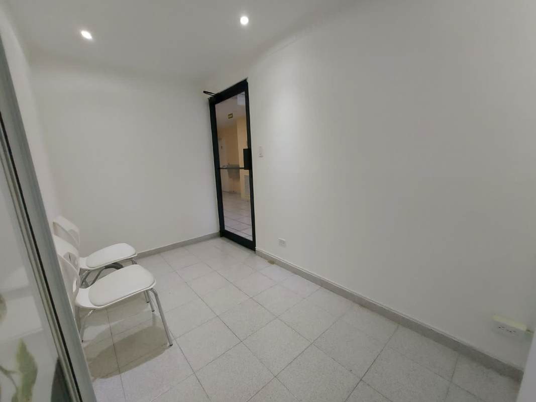 Simple waiting room area with chairs and tiled floor in PH Royal Center Medical Tower Panama