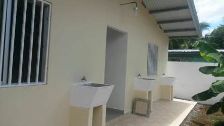 Simple one-story house with metal security fence and small yard David Chiriquí Panama