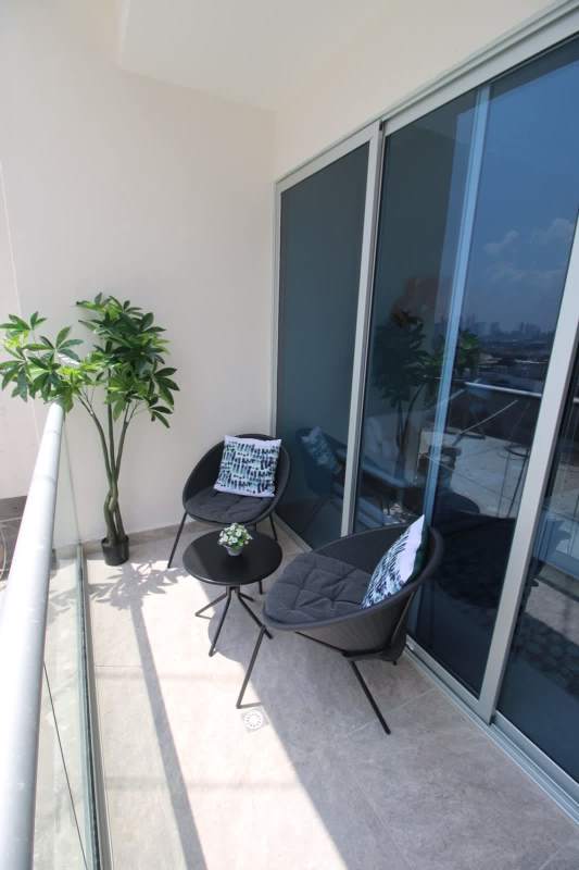 Private balcony with glass railing overlooking Panama City Hato Pintado