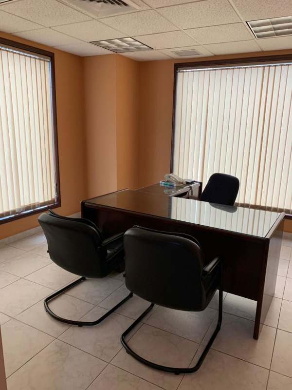 Bright private office workspace with window and furnishings PH Century Tower Marbella Panama