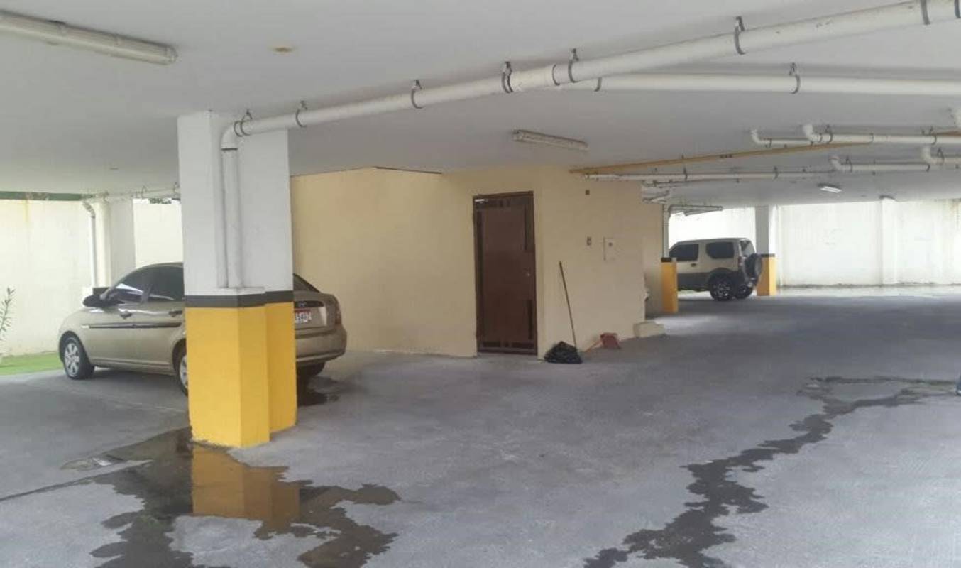 Small galley kitchen with cabinetry, stainless sink, tile floors PH La Loma Panama City