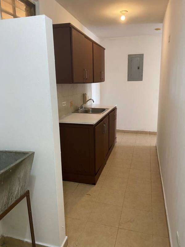Narrow kitchen with cabinetry, sink, and laundry space PH La Loma Pueblo Nuevo Panama