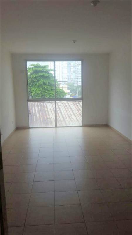 Living room with ceramic tile floor and large window in PH La Loma Panama City