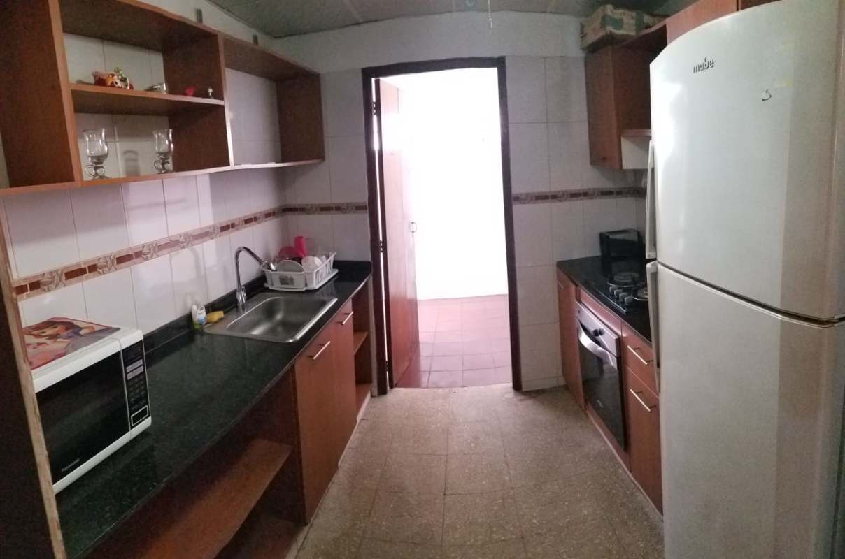 Simple bedroom with closet tiled floor and window in Chanis Pedregal Panama
