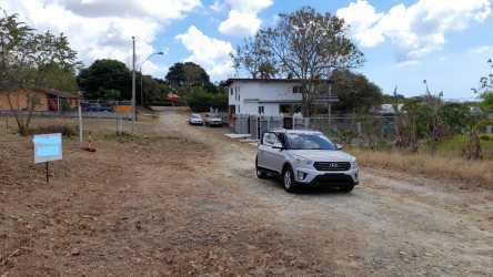 Open 800 m² lot with fencing, trees and dirt surface in Coronado Panama