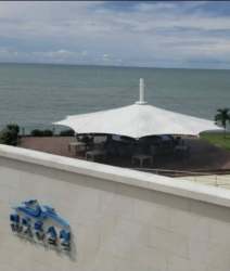 Luxury beachfront terrace with shaded lounge canopy, ocean panorama at Royal Palm Nueva Gorgona