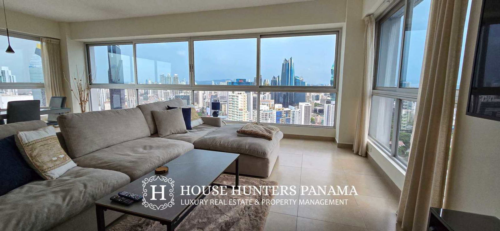 Remodeled kitchen with granite countertops, breakfast bar, and city views in PH Grand Bay Tower Avenida Balboa Panama