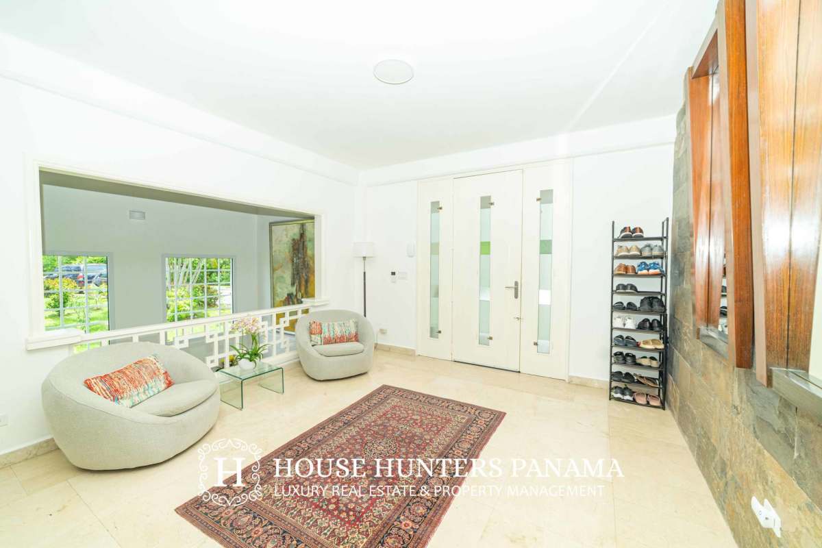 Designer marble bathroom with jacuzzi tub, glass-enclosed shower and double sink vanity in luxury house Panama