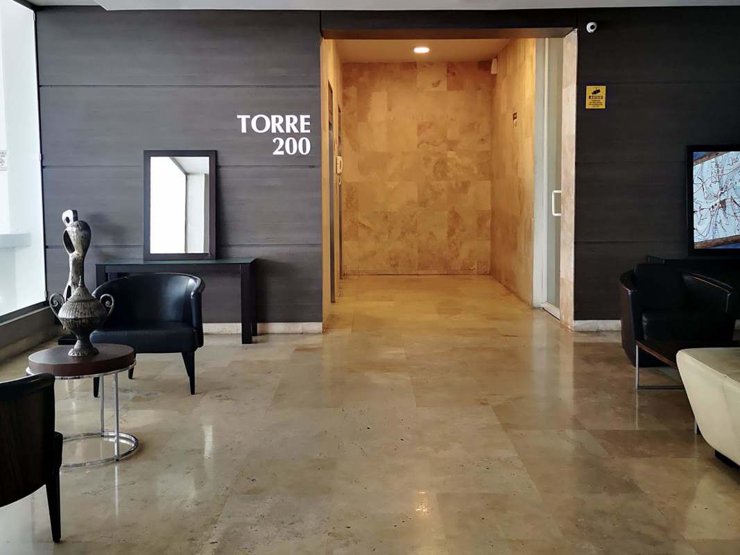Large modern lobby space with marble and wood finishes PH Mont Royale Panama