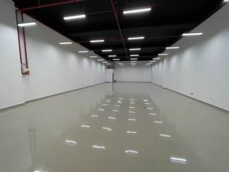 Empty finished interior of retail outlet with ceramic tiles and modern lighting Westland Mall Arraijan