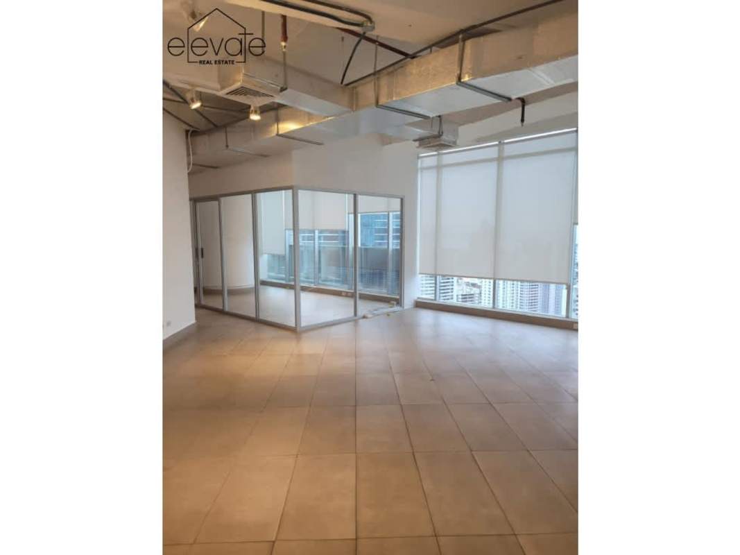 Modern high-rise office interior with panoramic city views in Revolution Tower Panama City