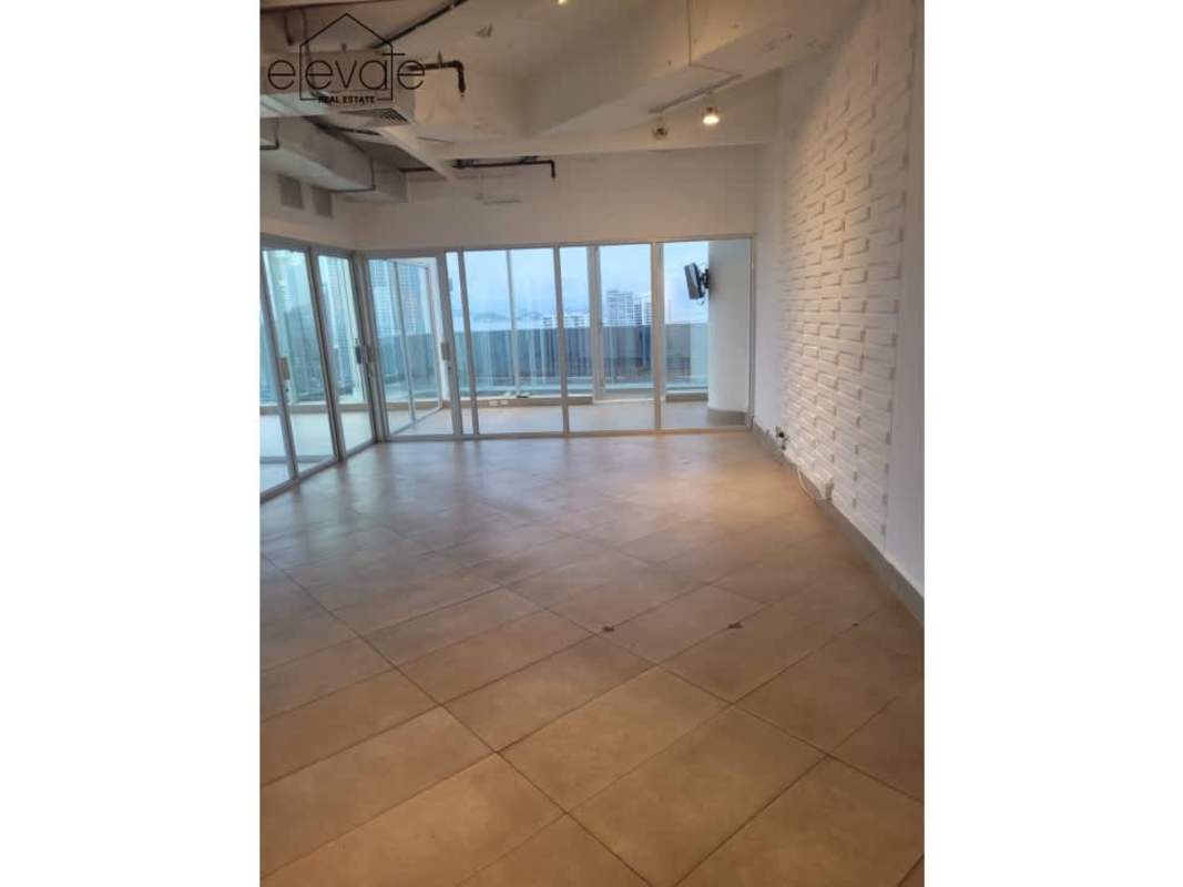 Spacious office interior with natural light, conference area, cityscape view in Revolution Tower Panama