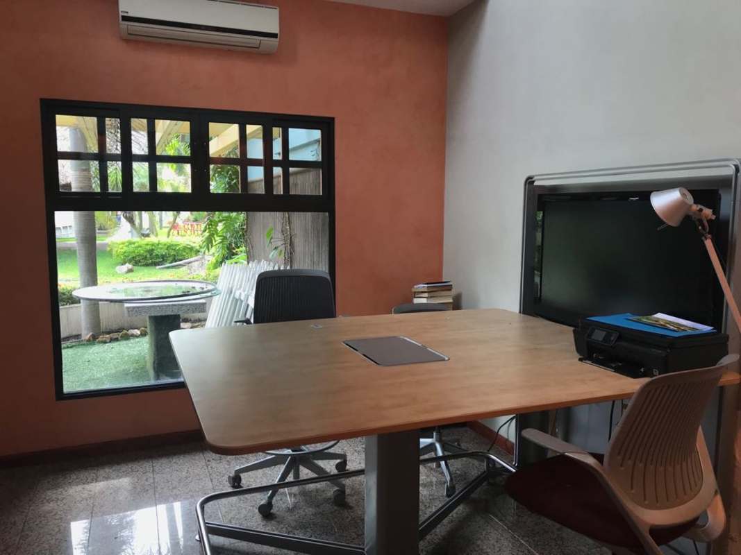Private commercial office with window, AC, wooden desk, garden view Altos del Golf Panama City