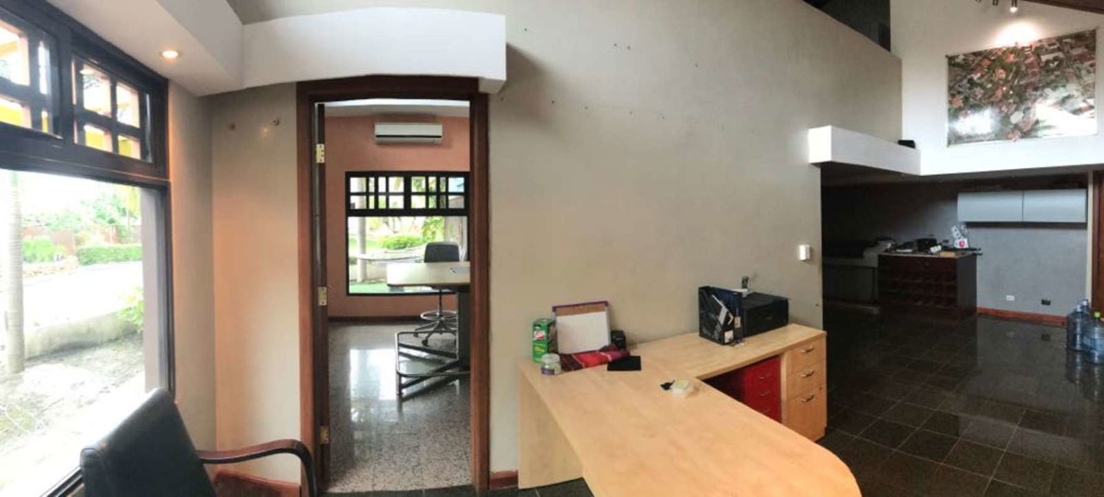 Open commercial workspace with large windows, tiled floors in Altos del Golf Panama City