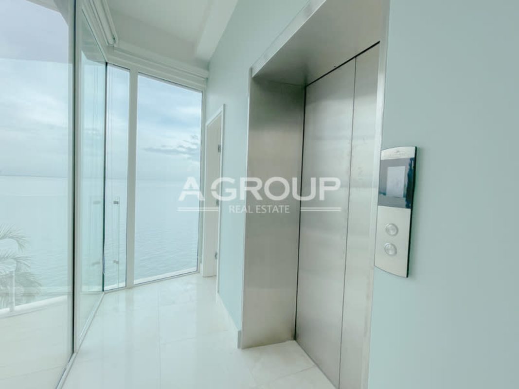 Luxury building lobby with panoramic glass overlooking marina in Ocean Reef Islands Panama