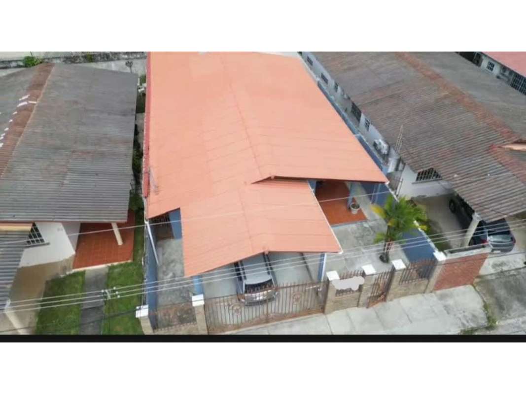 Aerial view single-level house with pitched roof, fenced yard in Brisas del Golf Panama