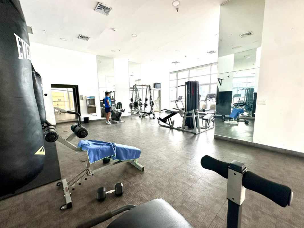 Modern fitness center with cardio and weights facing ocean view at PH White Tower Panama