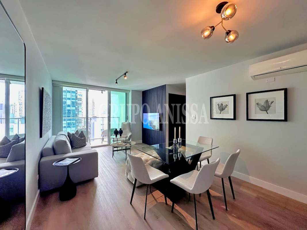 Open bright living room in PH Belle View with floor-to-ceiling windows offering bay view