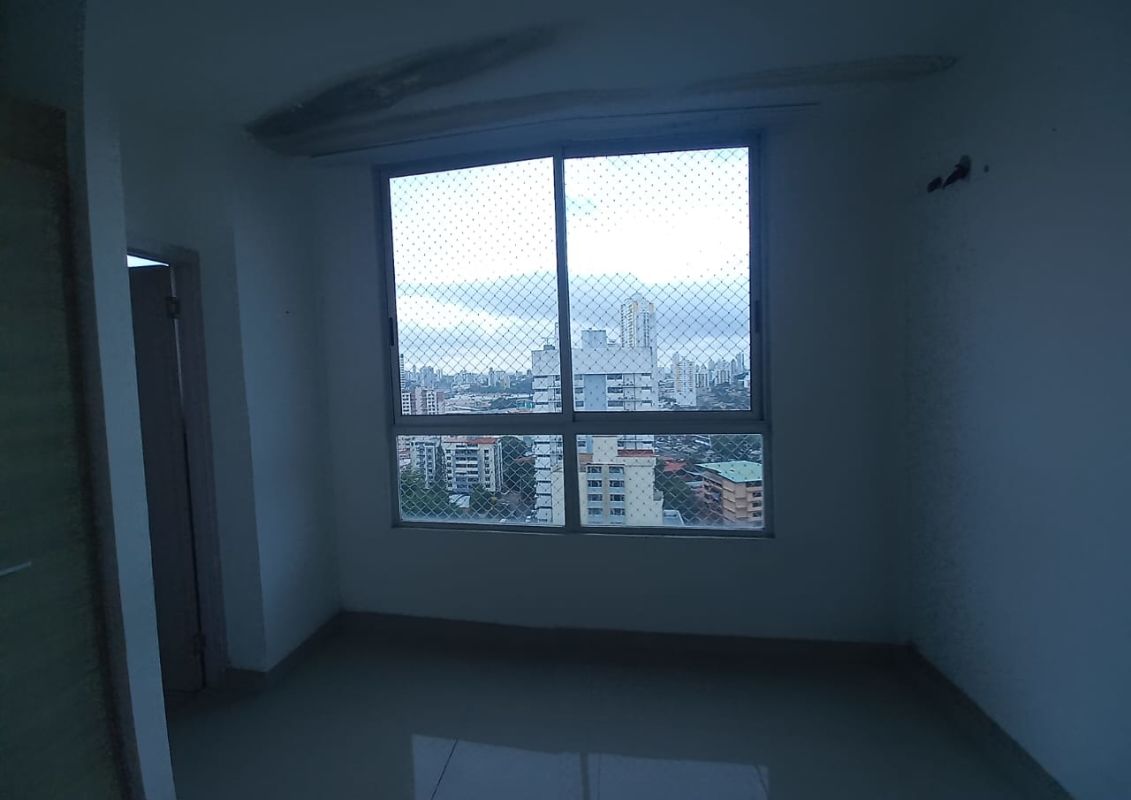 Modern bathroom with large mirror, vanity, glass shower, mosaic tile at PH Rainbow Tower Panama City