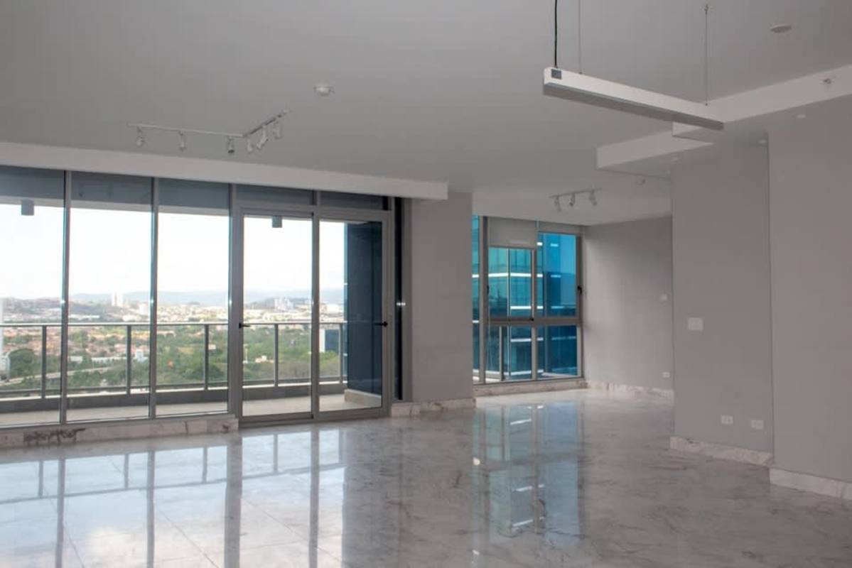 Expansive windows offering panoramic skyline views in Costa del Este penthouse apartment