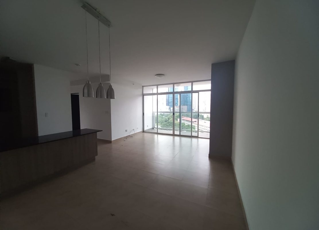 Living and dining room with large windows and city views in PH The One Tower San Francisco Panama