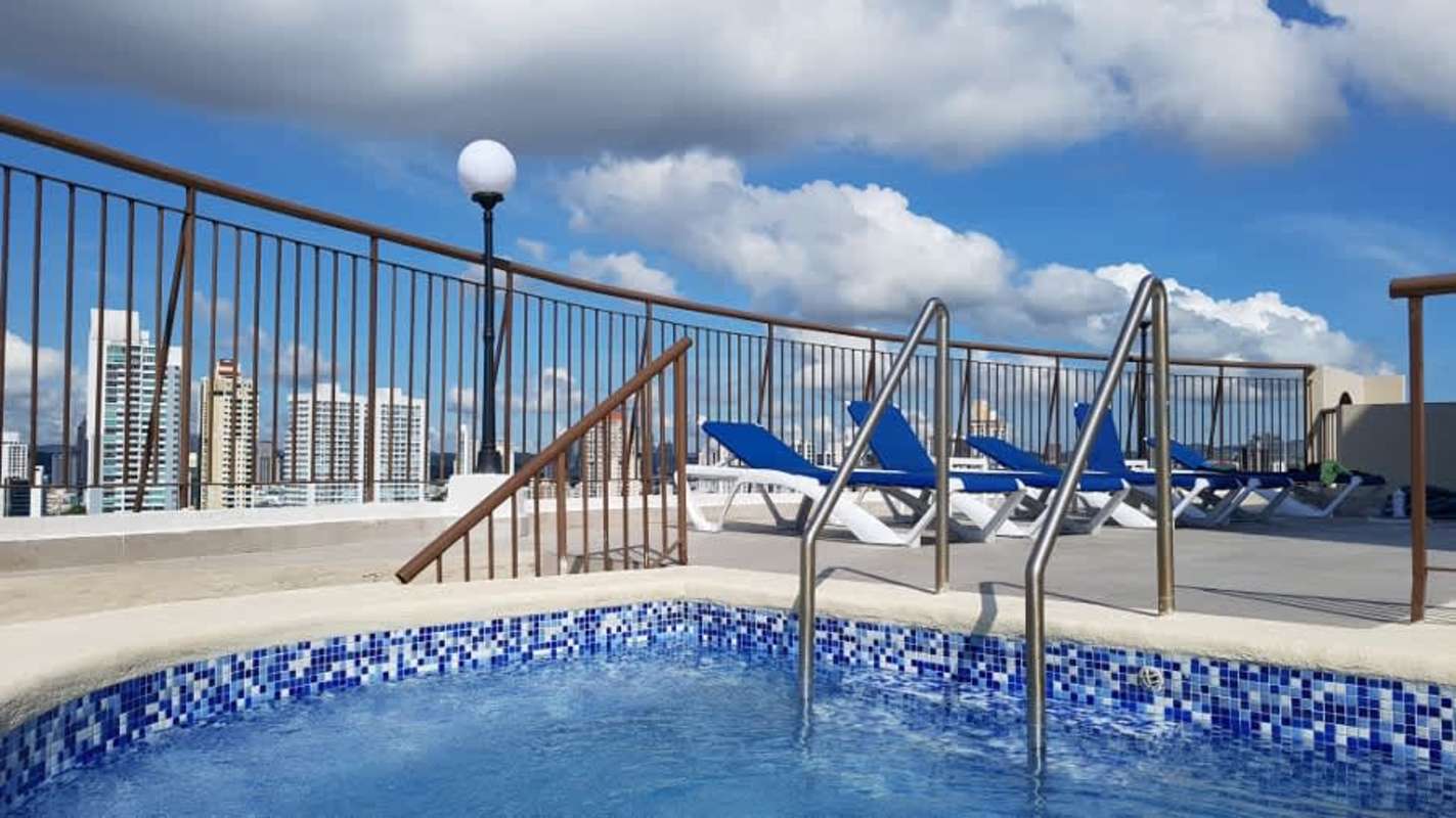 Rooftop swimming pool with sun deck and skyline views in PH Mar del Sur San Francisco Panama